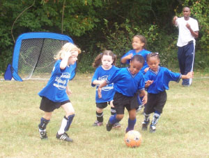 New Hope Academy students playing soccer
